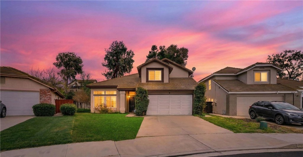 Single story Temecula home at sunset with a vivid pink sky